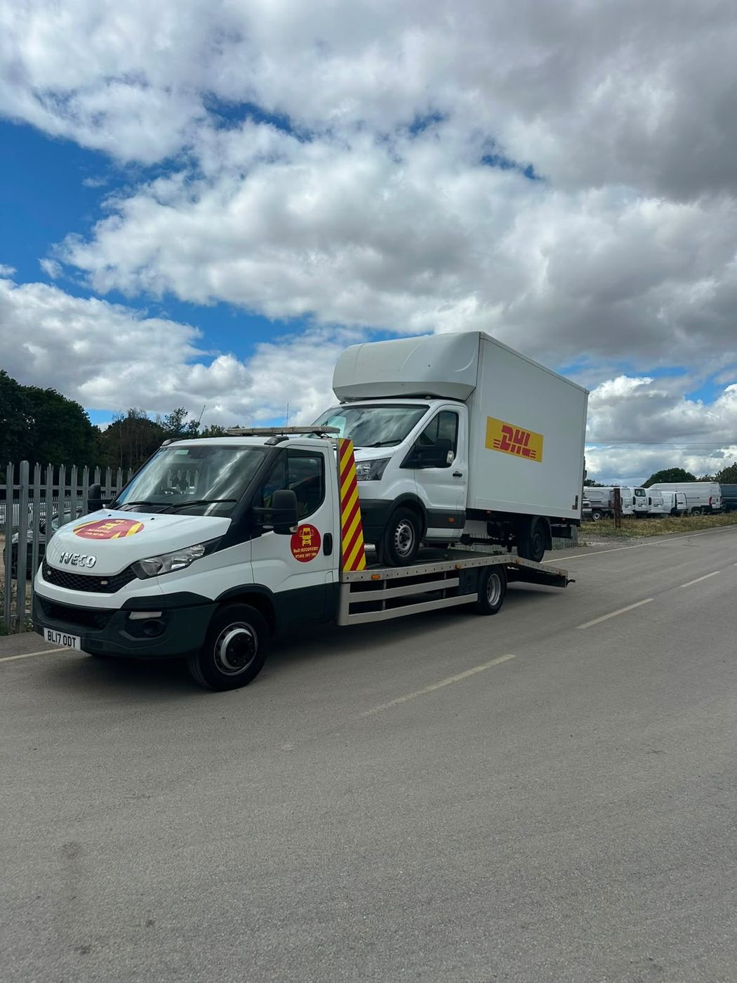Courier Luton box van loaded on a BnD Recovery flatbed truck