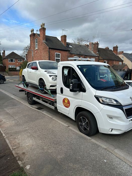 White Nissan Juke loaded on a BnD Recovery flatbed truck