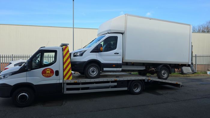 Ford Transit Luton box van loaded on a BnD Recovery flatbed truck